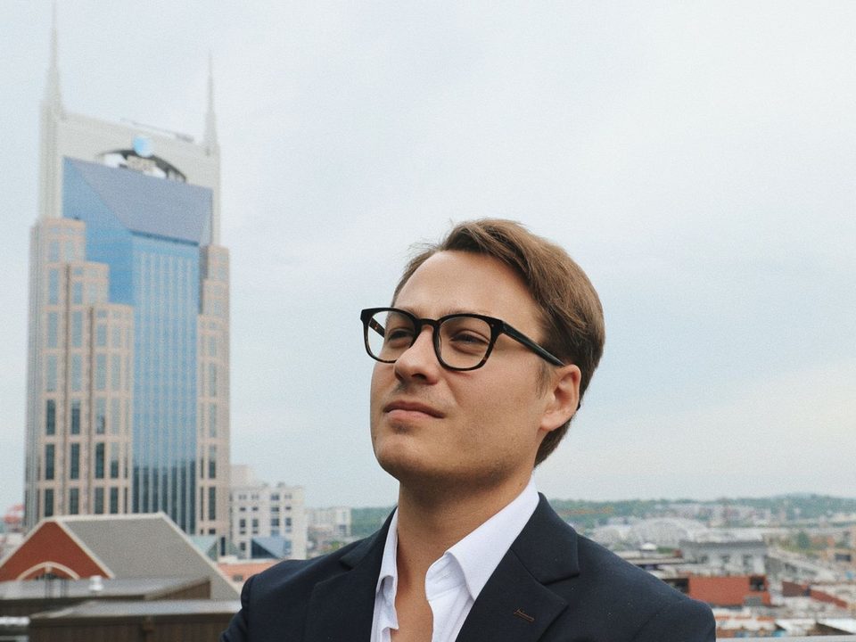 Kolton Stooksbury, founder of Raystone Automations, on a rooftop in downtown Nashville